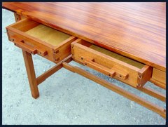 Shown with drawers partially open to reveal the exposed dovetail drawer construction.